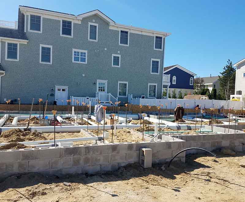 New construction plumbing rough-in installation at a residential foundation in Dennisville NJ by professional South Jersey plumbers.